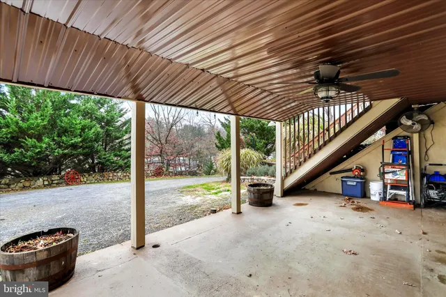 a view of a two chairs in the balcony