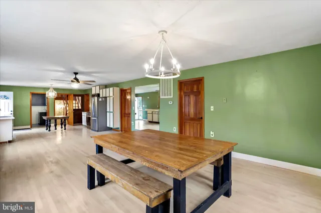 a kitchen with stainless steel appliances granite countertop a stove refrigerator and a microwave