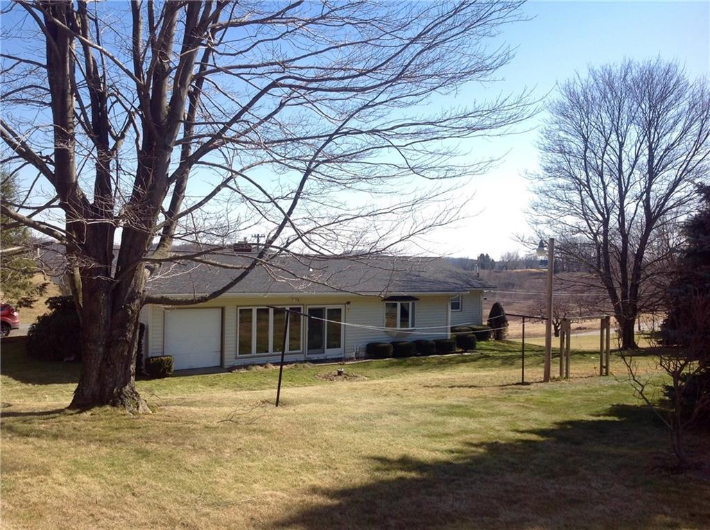 4462 Ellwood Road New Castle, PA 16101 - Photo 22 of 24 Back of Home - picture taken from the corner of the property. Third garage space is next to enclosed porch.