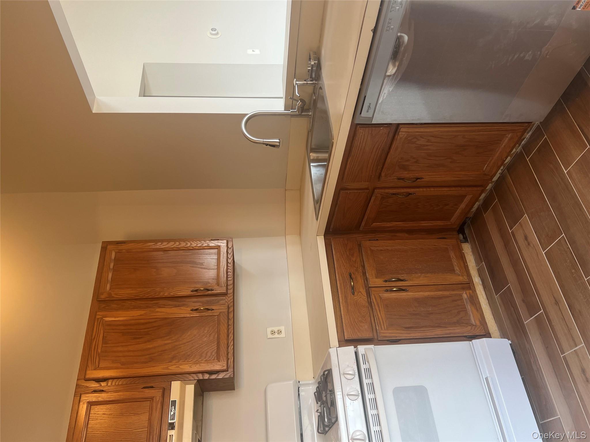 21 Lexington Hills Road, Unit 6 Harriman, NY 10926 - Photo 2 of 9 a kitchen with a sink cabinets and appliances