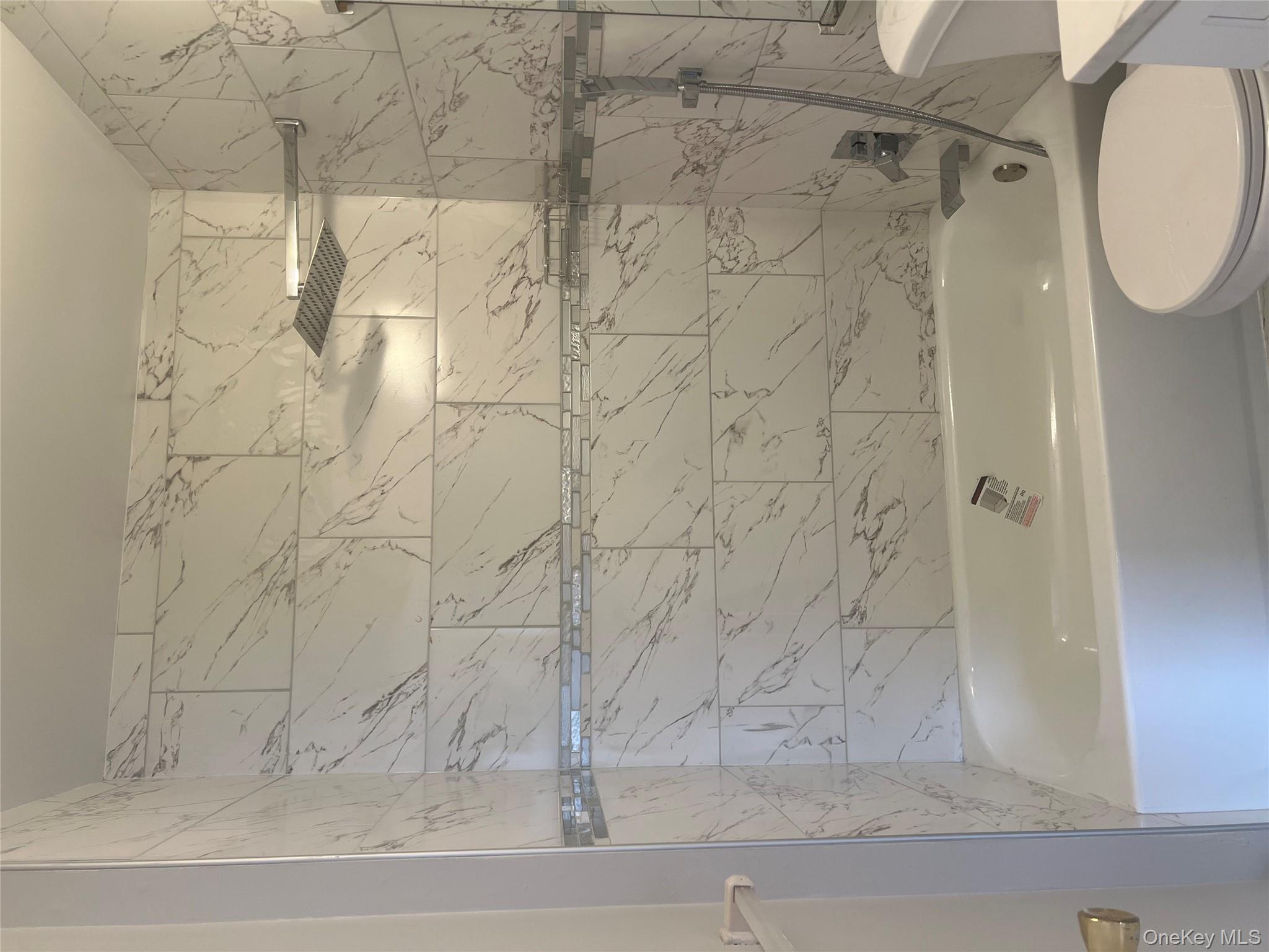 21 Lexington Hills Road, Unit 6 Harriman, NY 10926 - Photo 5 of 9 a bathroom with a toilet and a bath tub