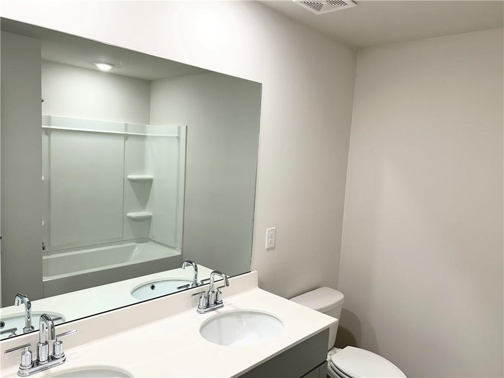 6901 Durham Lane Fairburn, GA 30213 - Photo 22 of 29 a bathroom with a sink toilet and shower