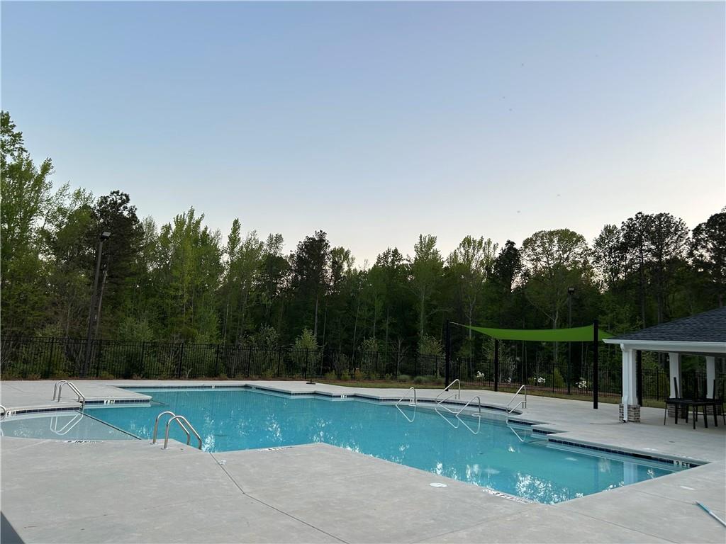 6901 Durham Lane Fairburn, GA 30213 - Photo 28 of 29 a view of a swimming pool with a yard