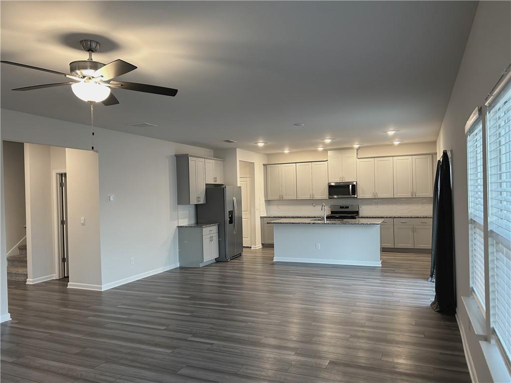 6901 Durham Lane Fairburn, GA 30213 - Photo 6 of 29 a view of kitchen with refrigerator and microwave