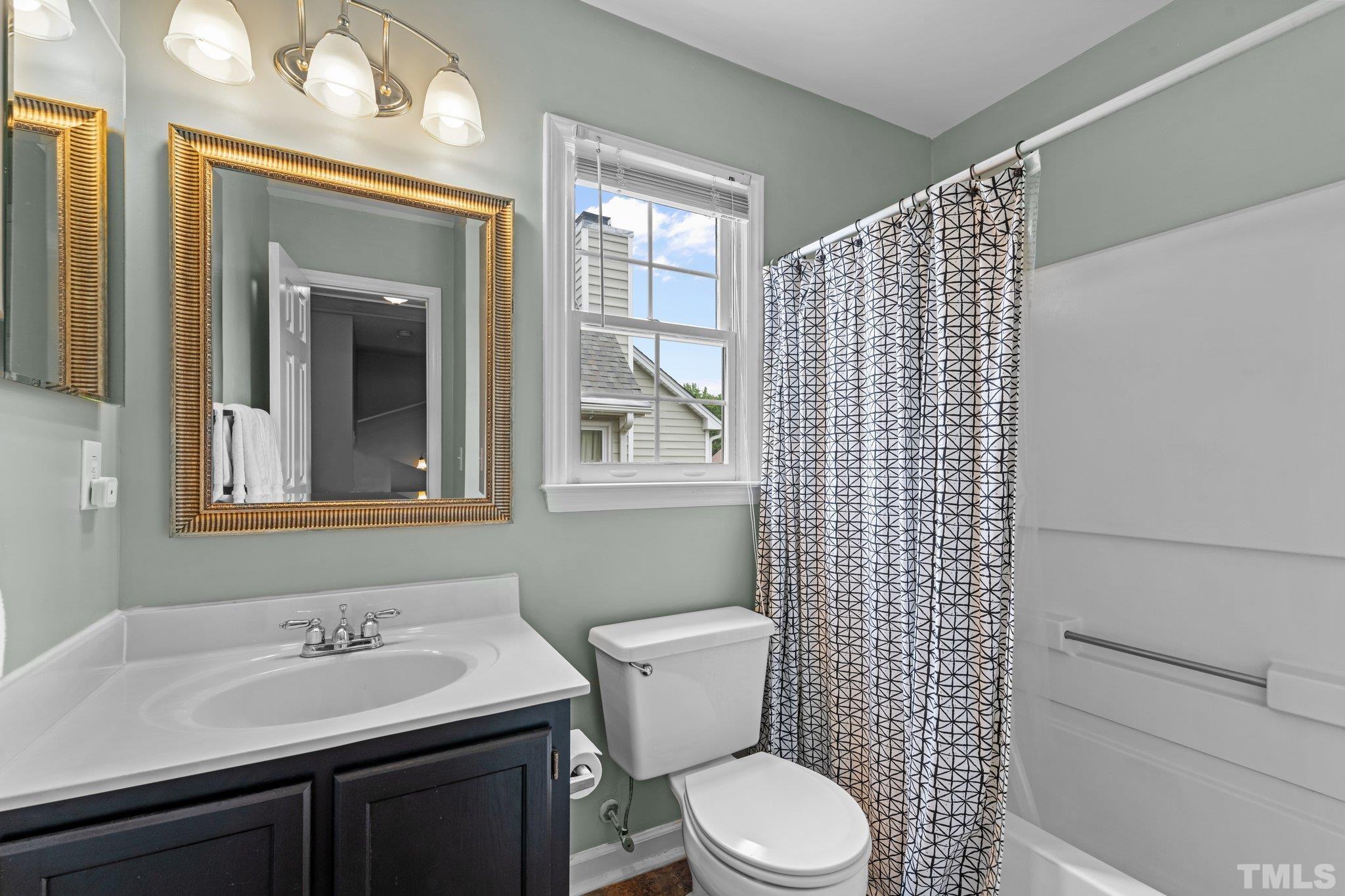 11325 North Radner Way Raleigh, NC 27613 - Photo 21 of 29 a bathroom with a sink a toilet and shower