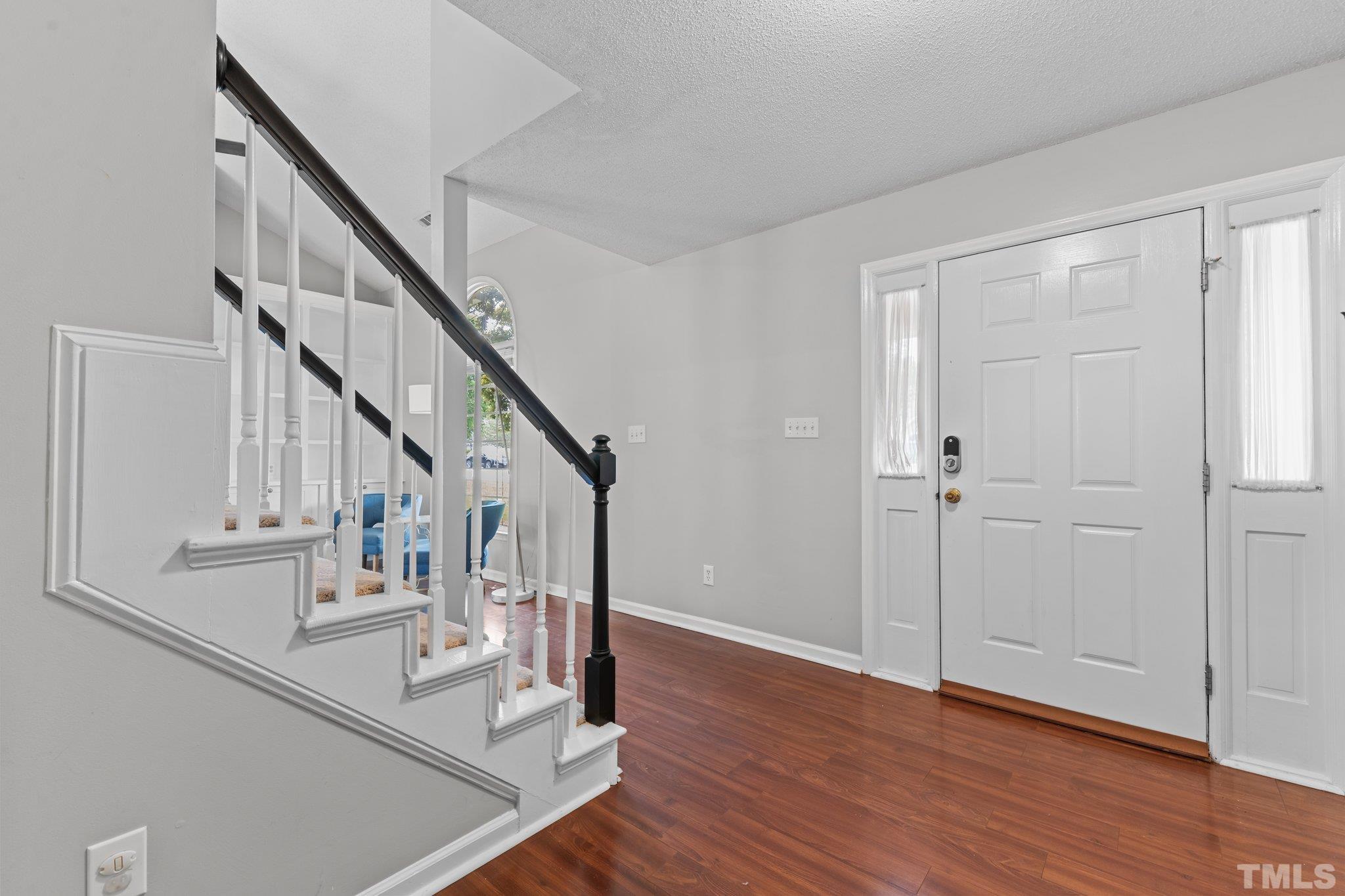 11325 North Radner Way Raleigh, NC 27613 - Photo 5 of 29 a view of entryway and hall with wooden floor