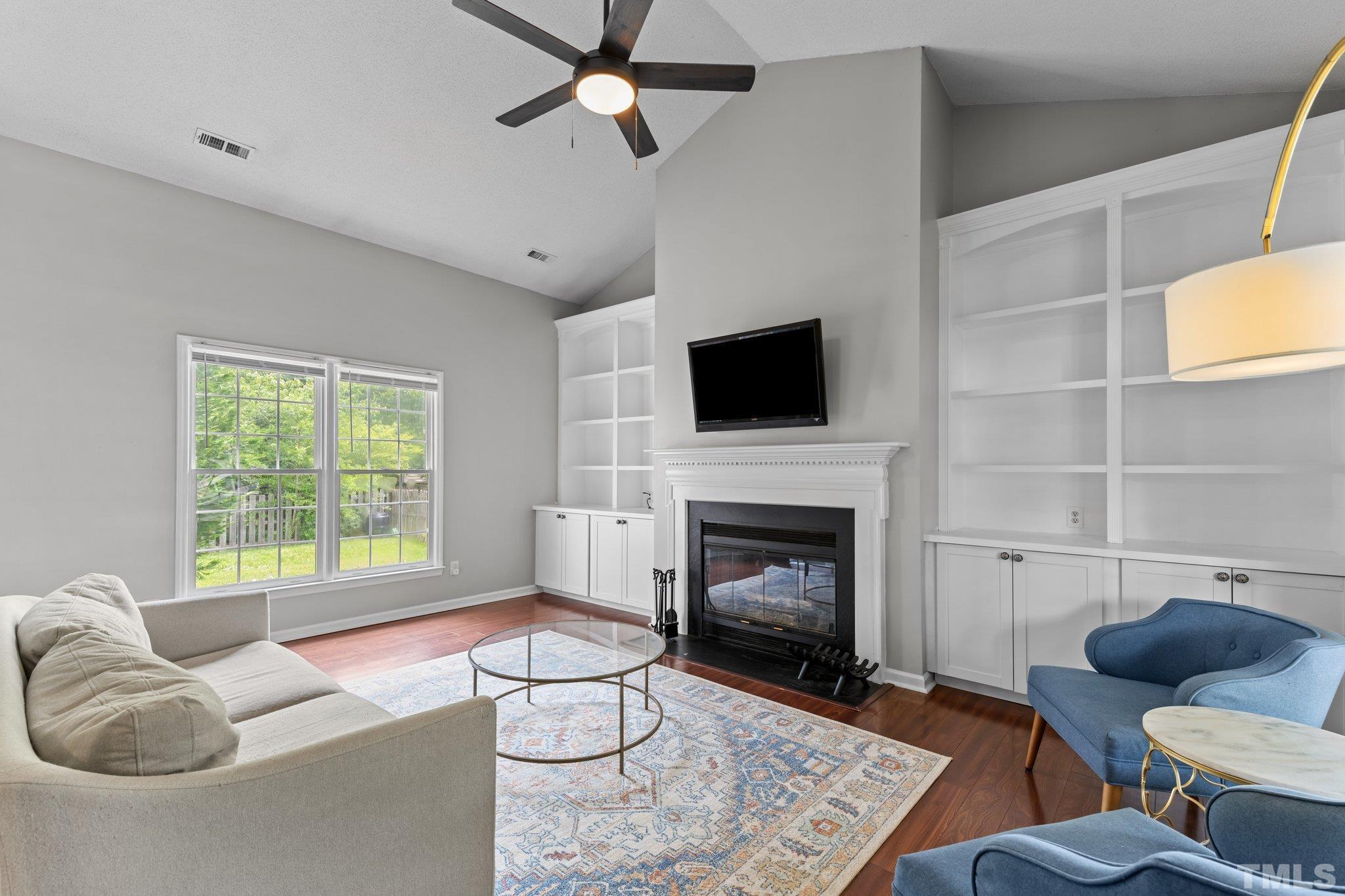 11325 North Radner Way Raleigh, NC 27613 - Photo 6 of 29 a living room with furniture and a fireplace