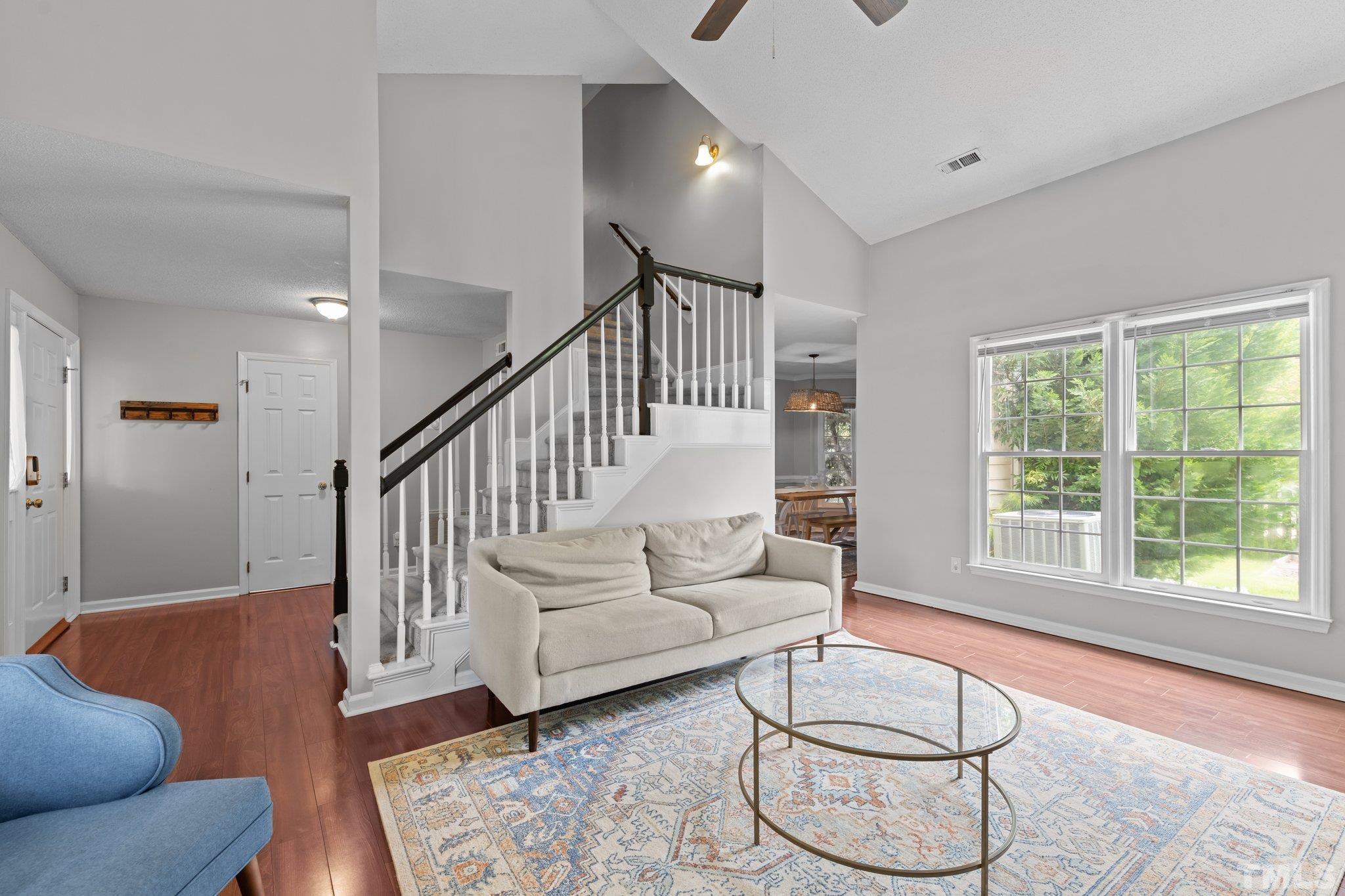 11325 North Radner Way Raleigh, NC 27613 - Photo 8 of 29 a living room with white couches furniture and a large window
