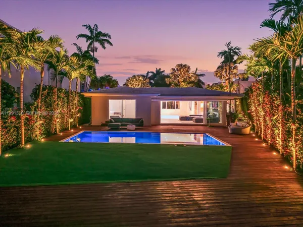 a view of house with swimming pool yard and outdoor seating