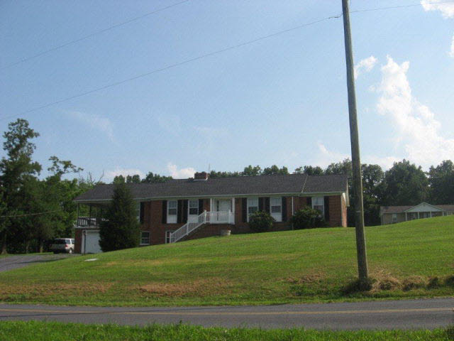 738 Conicville Road Mount Jackson, VA 22842 - Photo 4 of 5 a view of a big house in a big yard with large trees