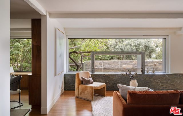 a view of a city from a dining room with large windows