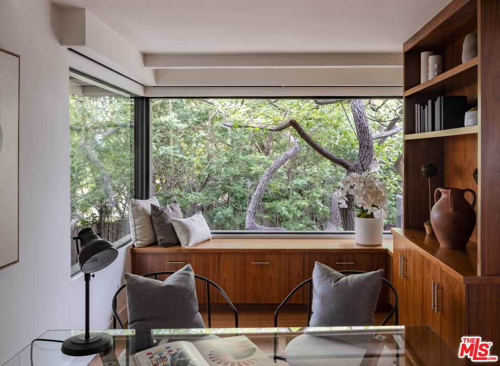1575 Carla Ridge Beverly Hills, CA 90210 - Photo 12 of 39 a view of a city from a dining room with large windows