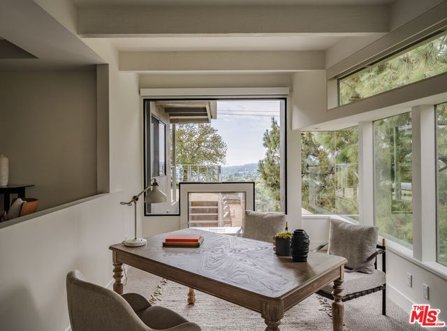 a bedroom with furniture and a window
