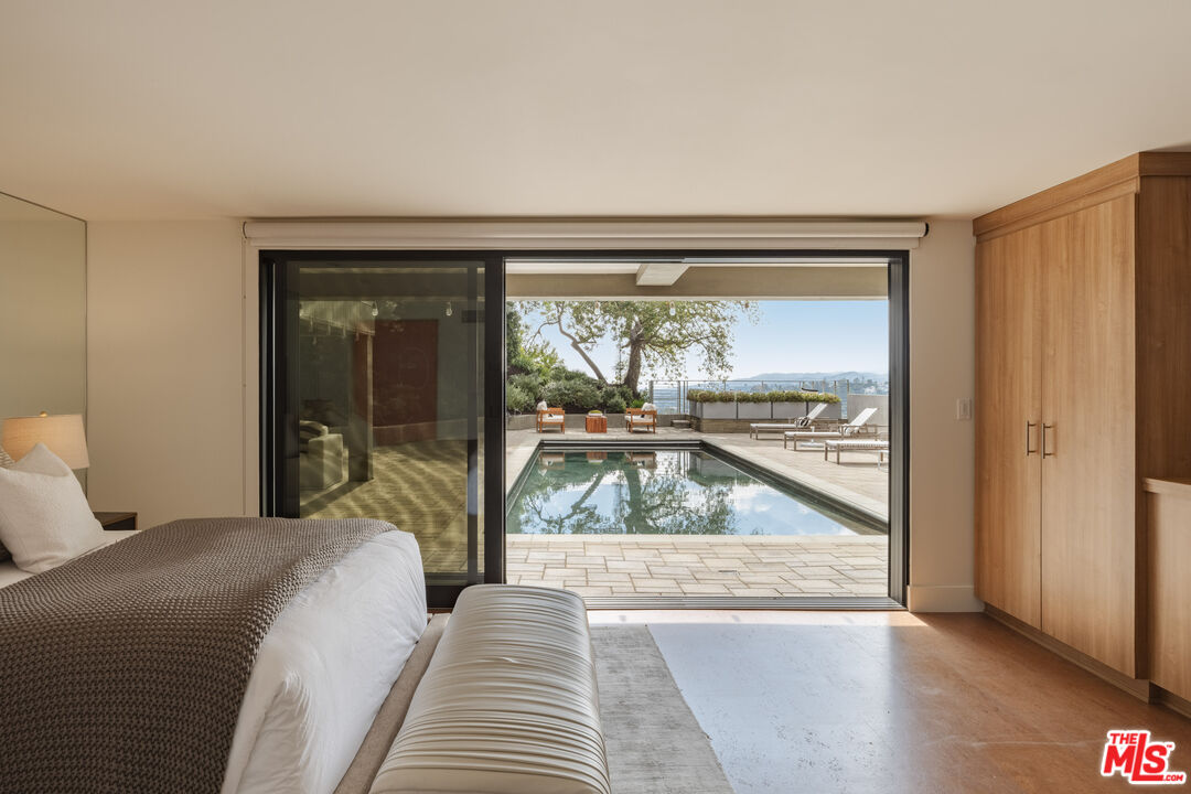 1575 Carla Ridge Beverly Hills, CA 90210 - Photo 32 of 39 a view of a living room and a window