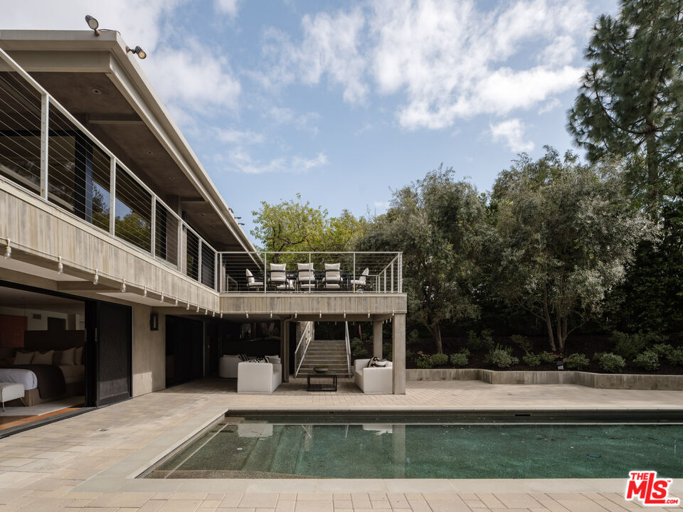 1575 Carla Ridge Beverly Hills, CA 90210 - Photo 33 of 39 a view of a house with a yard