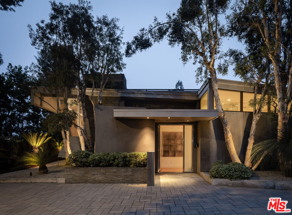 1575 Carla Ridge Beverly Hills, CA 90210 - Photo 37 of 39 a view of a house with a tree