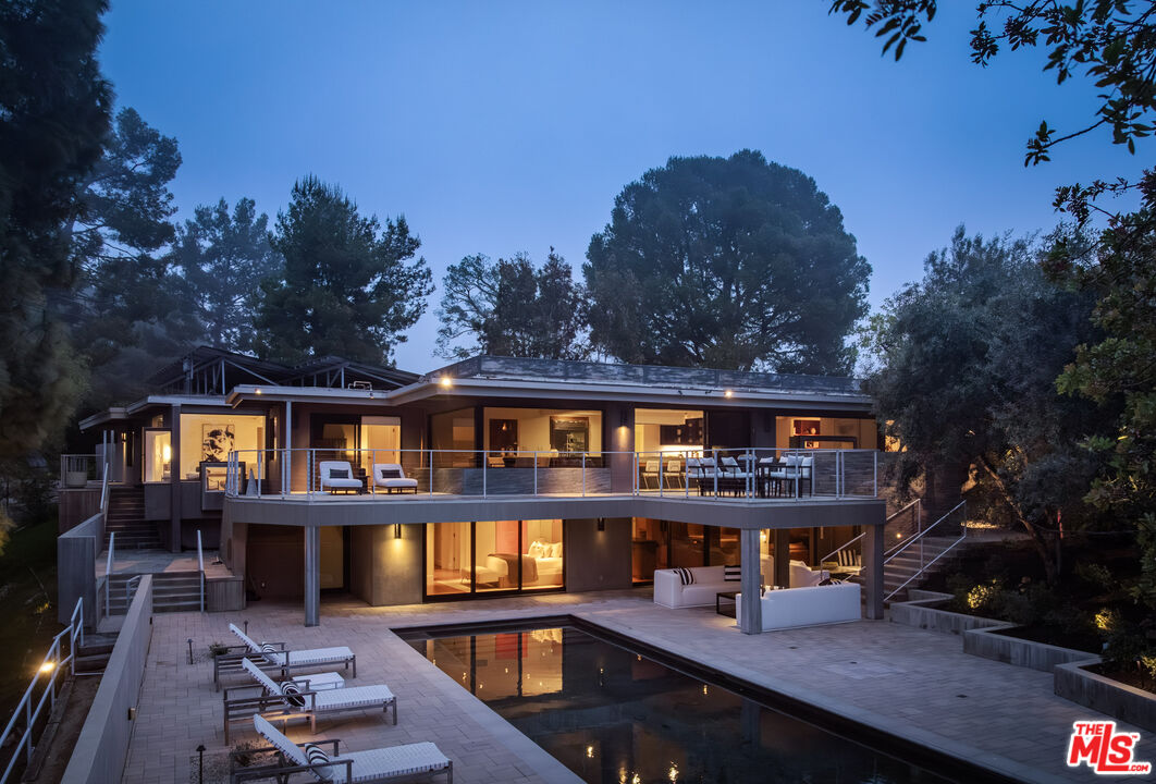1575 Carla Ridge Beverly Hills, CA 90210 - Photo 39 of 39 a balcony with wooden floor and outdoor seating
