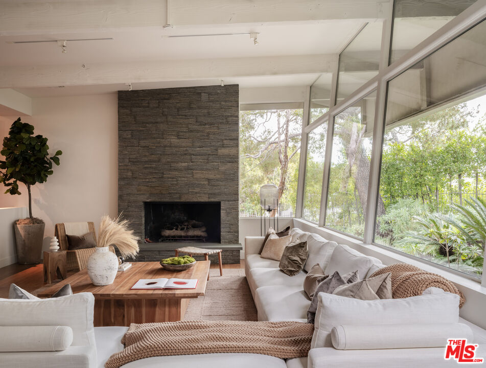 1575 Carla Ridge Beverly Hills, CA 90210 - Photo 6 of 39 a living room with furniture and a fireplace