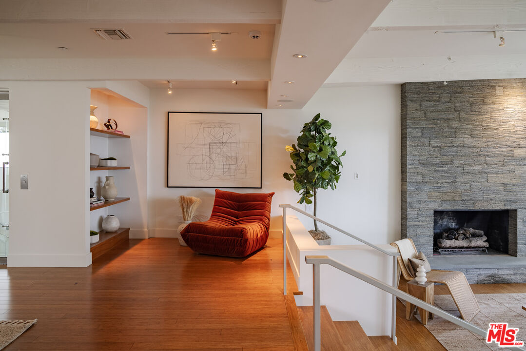 1575 Carla Ridge Beverly Hills, CA 90210 - Photo 9 of 39 a living room with furniture and a fireplace