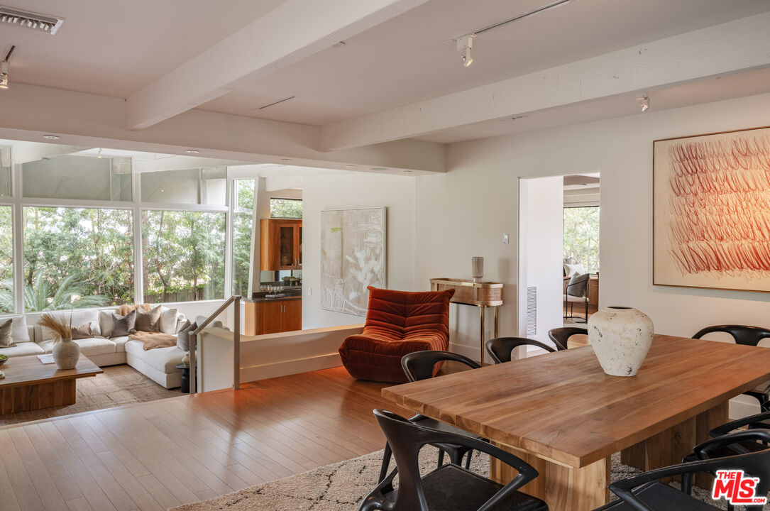 1575 Carla Ridge Beverly Hills, CA 90210 - Photo 10 of 39 a view of a dining room with furniture window and wooden floor