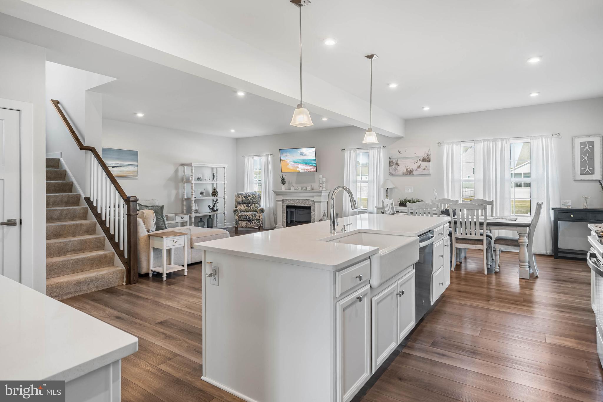 19079 Trimaran Drive Lewes, DE 19958 - Photo 15 of 61 a large kitchen with stainless steel appliances kitchen island granite countertop a large center island attached withe living room
