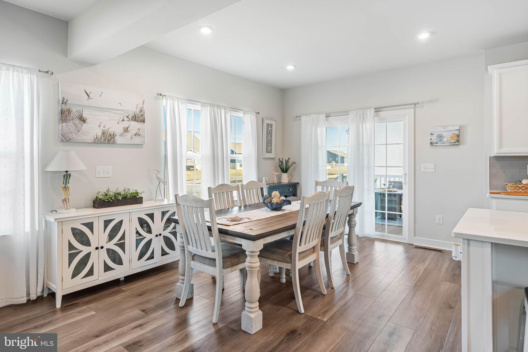 19079 Trimaran Drive Lewes, DE 19958 - Photo 19 of 61 a view of a dining room with furniture window and wooden floor