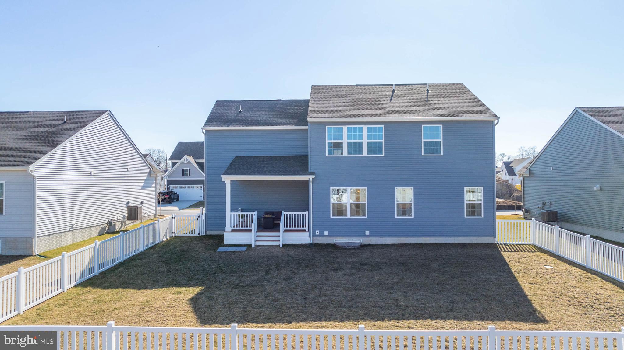 19079 Trimaran Drive Lewes, DE 19958 - Photo 24 of 61 a view of a brick house with large windows