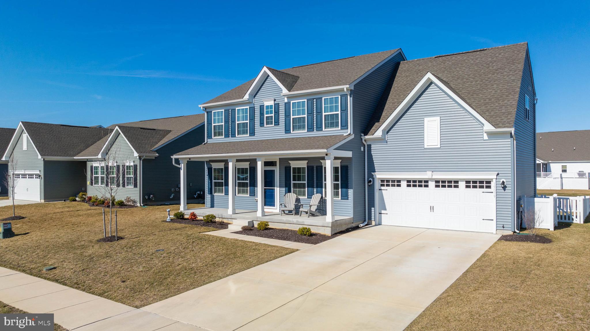 19079 Trimaran Drive Lewes, DE 19958 - Photo 3 of 61 a front view of a house with a yard
