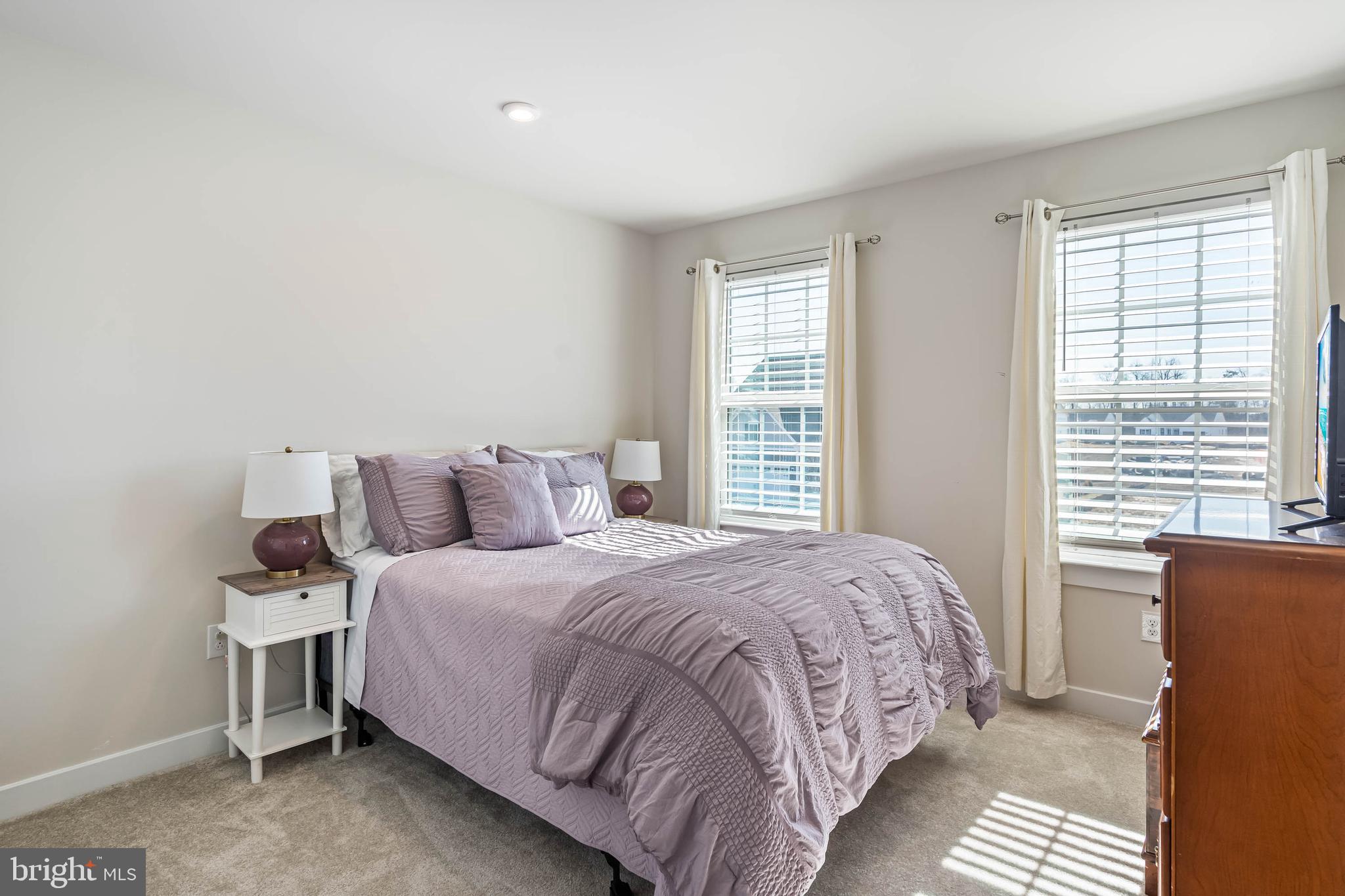 19079 Trimaran Drive Lewes, DE 19958 - Photo 34 of 61 a bedroom with a bed and a window