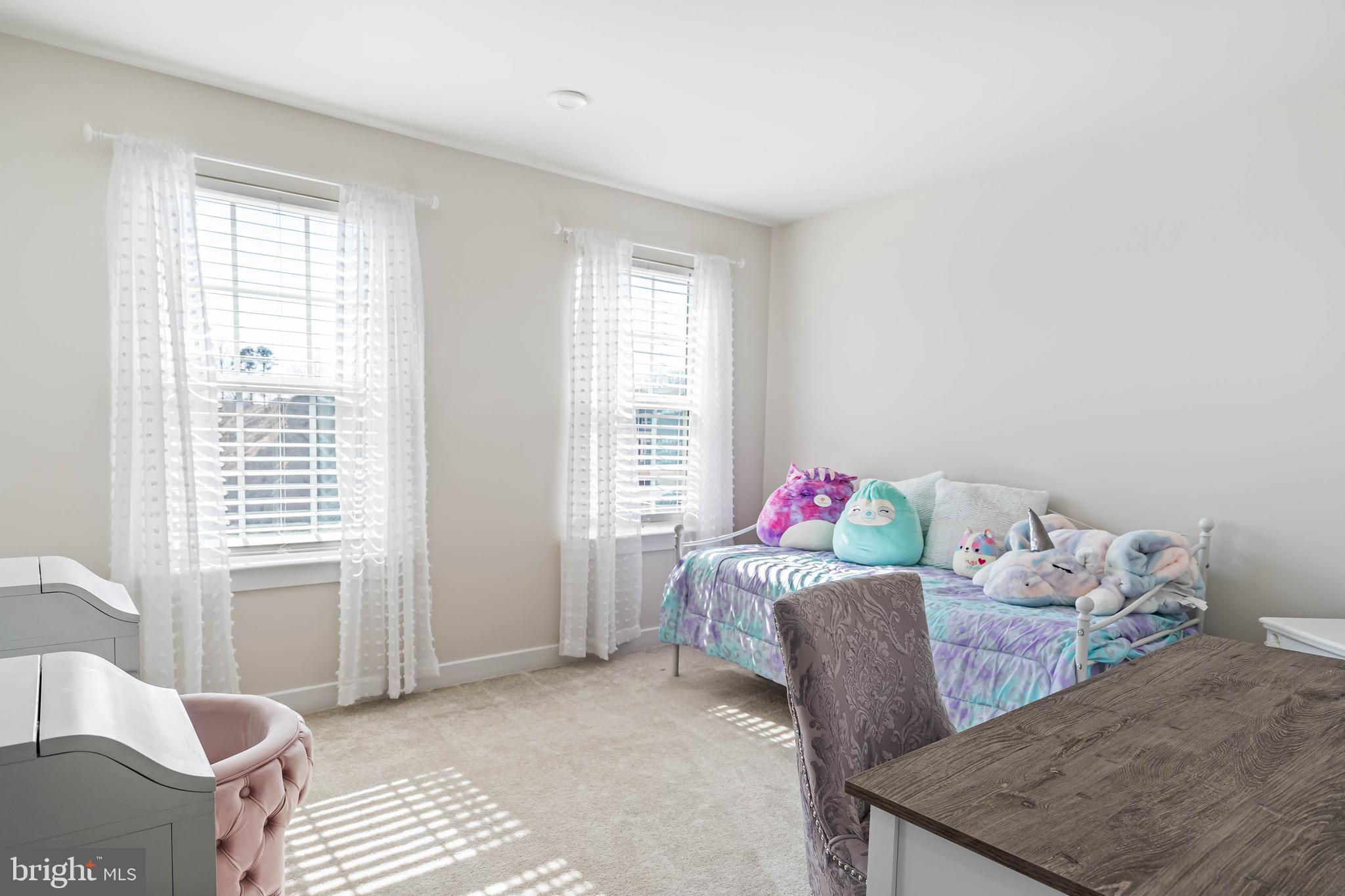 19079 Trimaran Drive Lewes, DE 19958 - Photo 39 of 61 a living room with furniture and a window