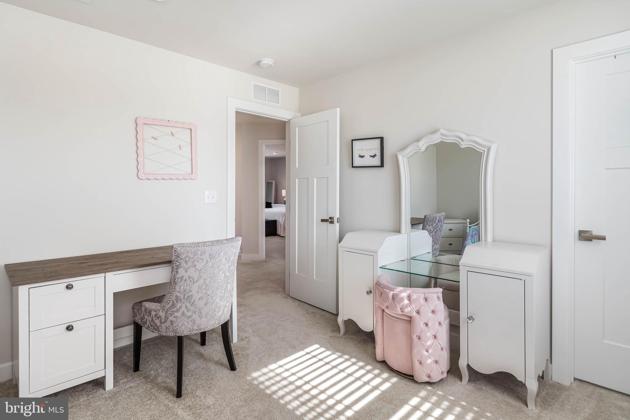 19079 Trimaran Drive Lewes, DE 19958 - Photo 40 of 61 a living room with furniture and a mirror