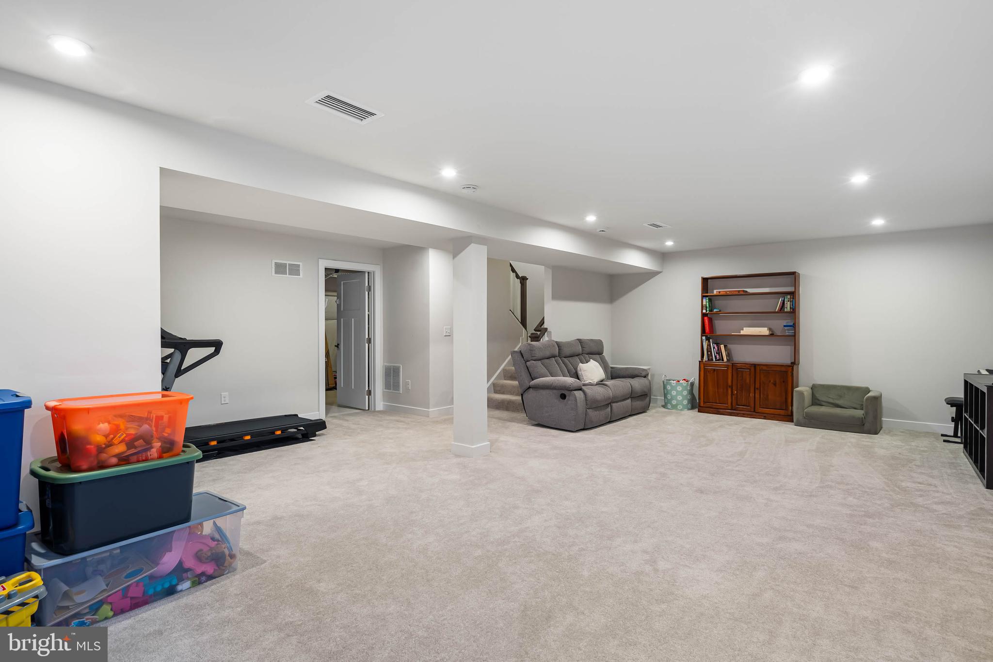 19079 Trimaran Drive Lewes, DE 19958 - Photo 43 of 61 a large room with furniture and window