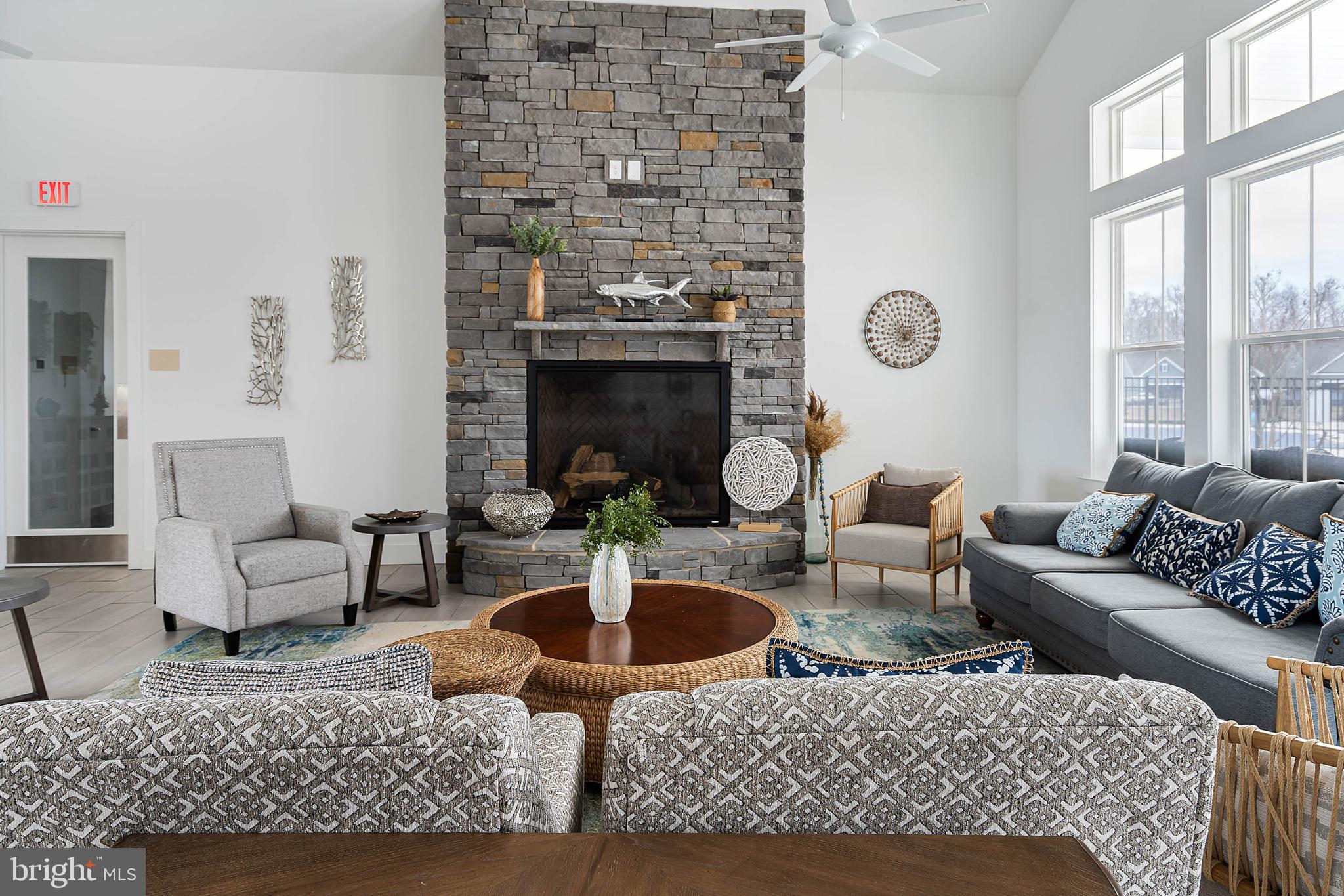 19079 Trimaran Drive Lewes, DE 19958 - Photo 57 of 61 a living room with fireplace furniture and a large window