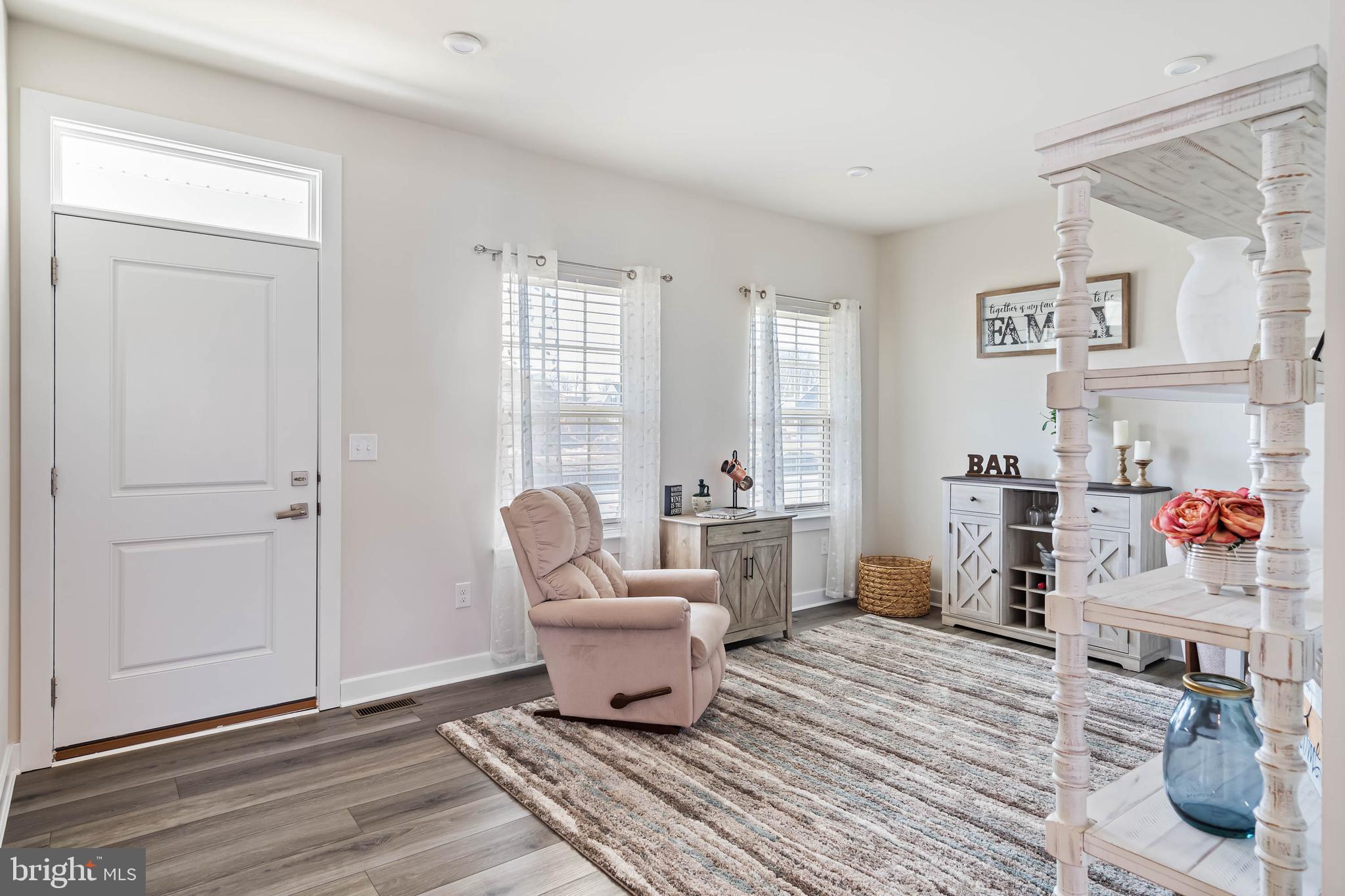 19079 Trimaran Drive Lewes, DE 19958 - Photo 7 of 61 a living room with furniture and a window