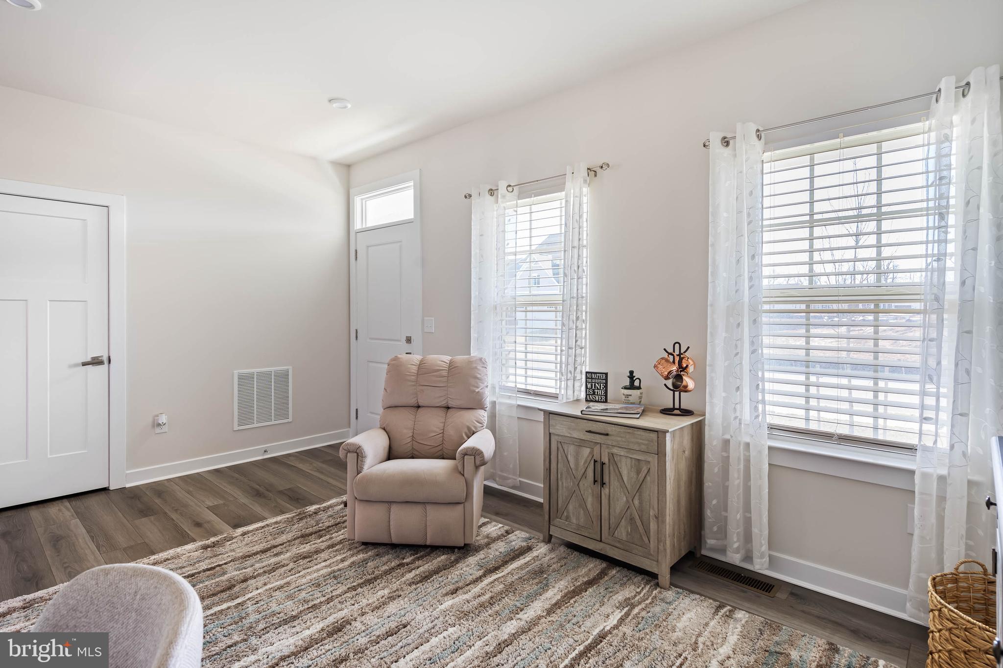 19079 Trimaran Drive Lewes, DE 19958 - Photo 8 of 61 a living room with furniture and a window