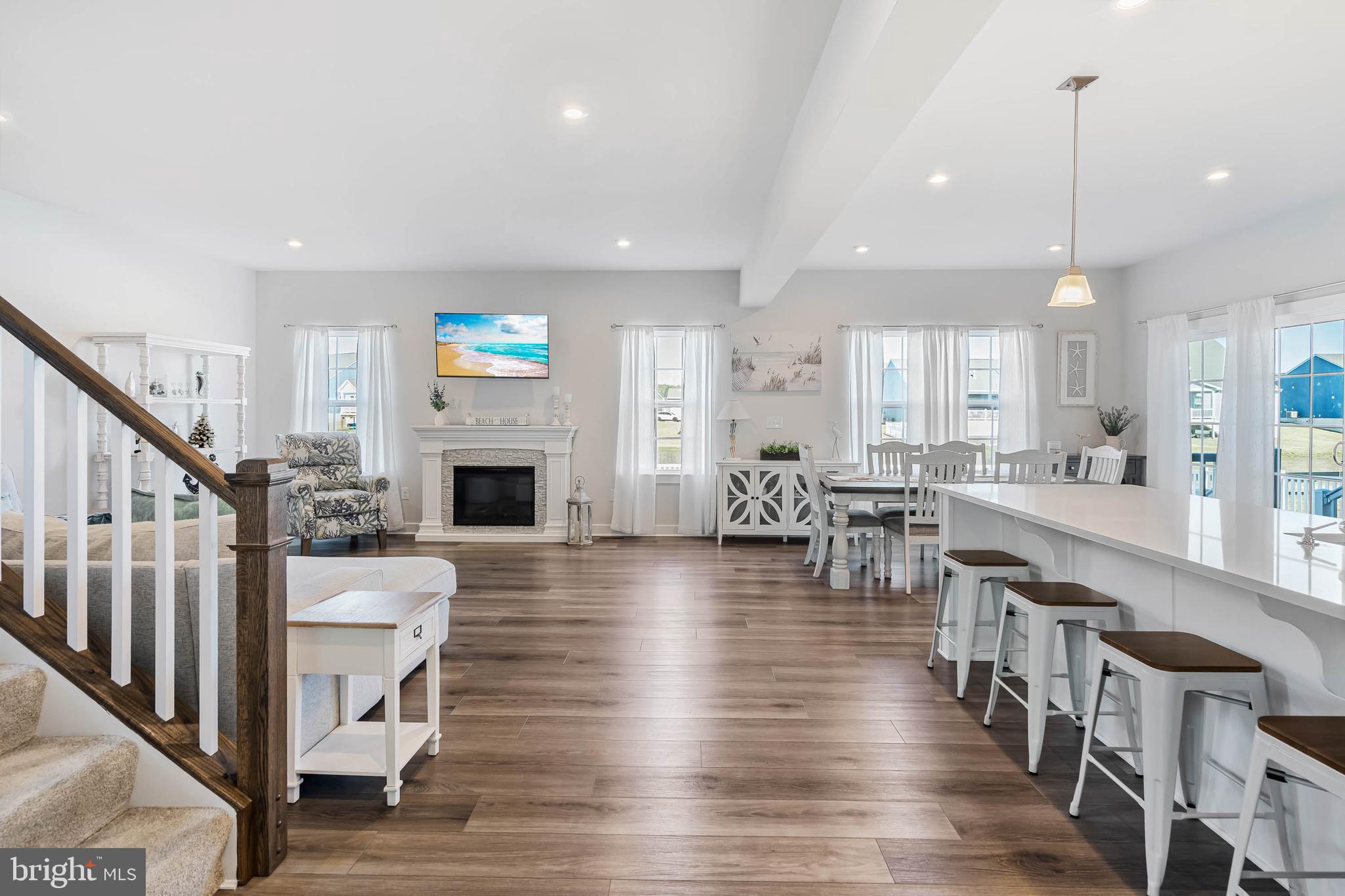 19079 Trimaran Drive Lewes, DE 19958 - Photo 9 of 61 a view of kitchen and dining room with wooden floor