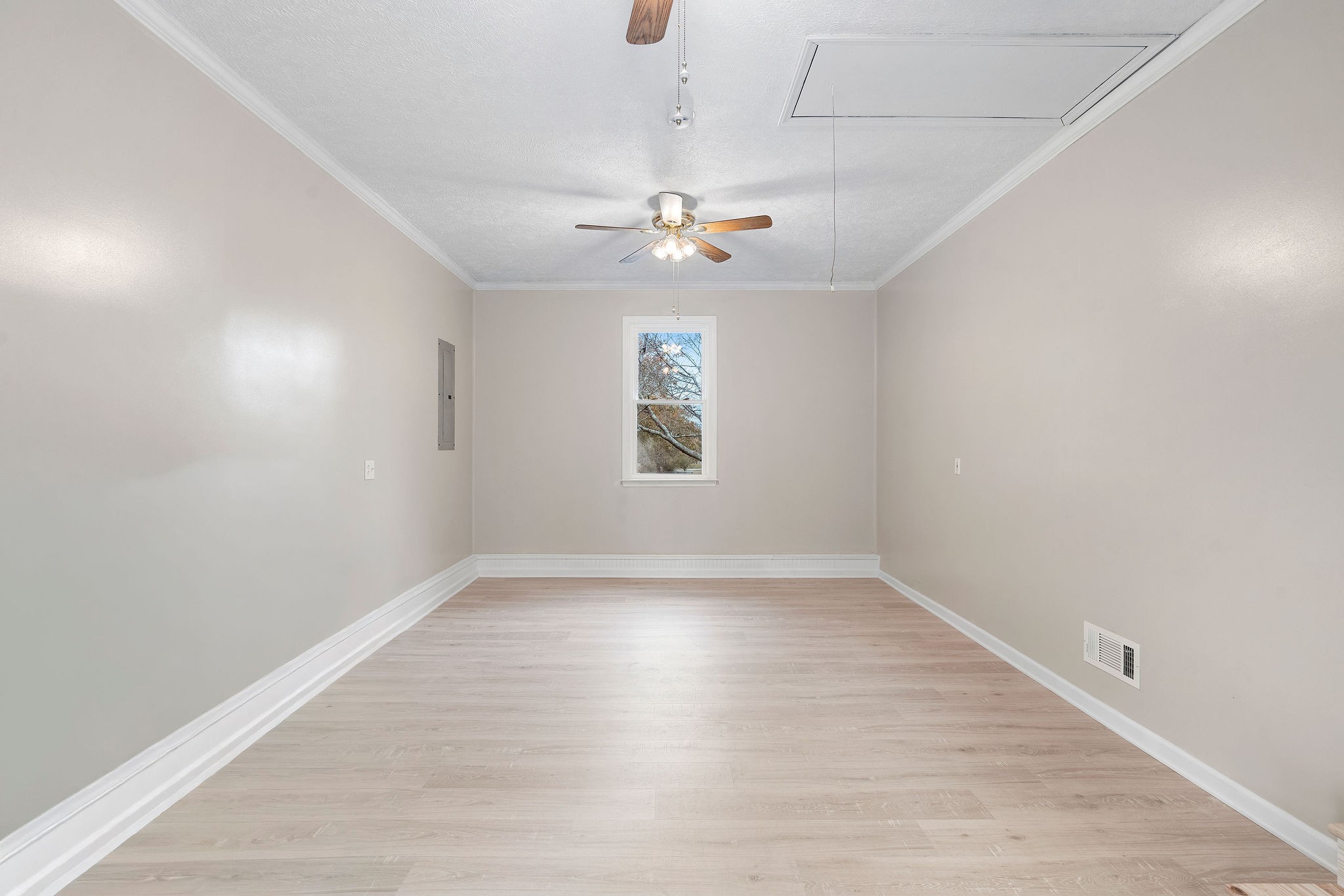 111 Slidell Court Rockvale, TN 37153 - Photo 13 of 27 an empty room with wooden floor ceiling fan and windows
