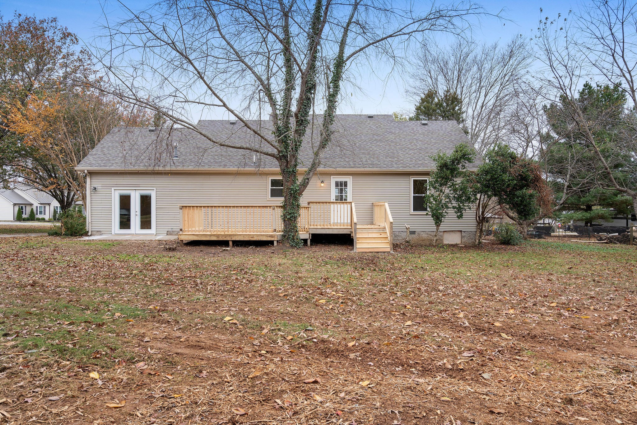 111 Slidell Court Rockvale, TN 37153 - Photo 22 of 27 a white house that has a tree in front of it