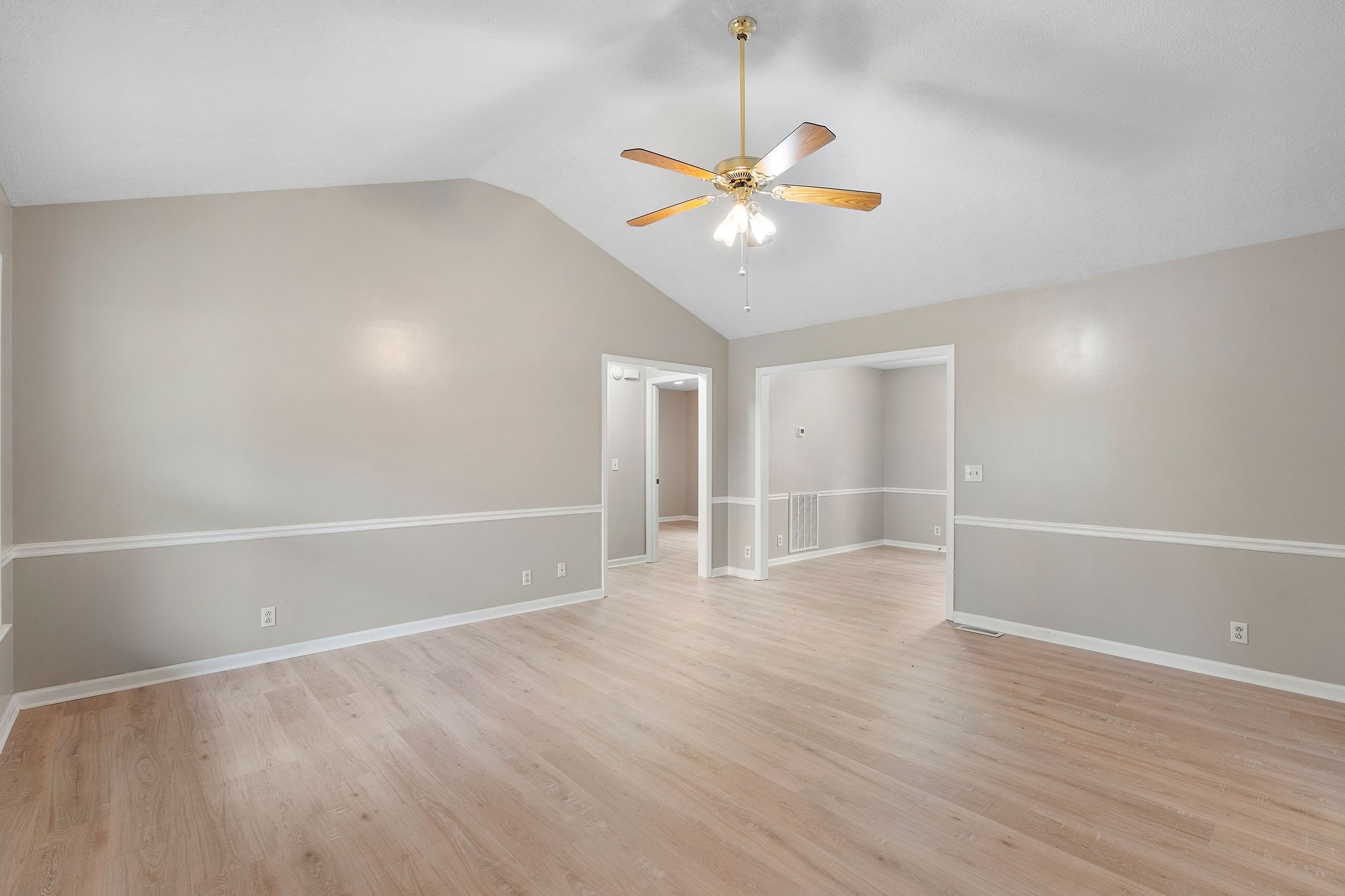 111 Slidell Court Rockvale, TN 37153 - Photo 4 of 27 an empty room with wooden floor fan and windows