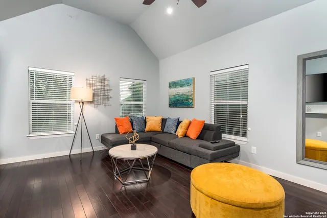 a living room with furniture and a window