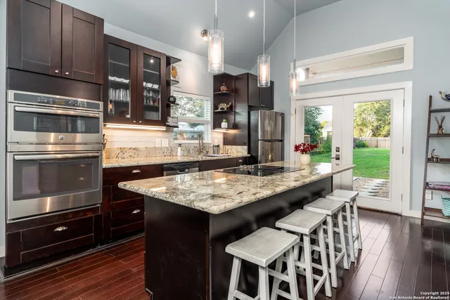 a kitchen with a stove and a refrigerator