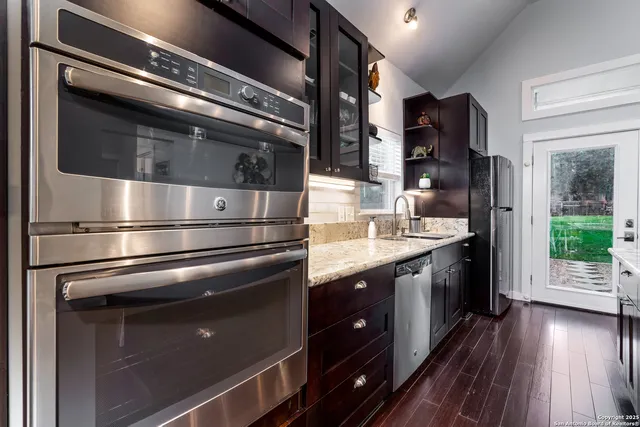 a kitchen with a stove and a refrigerator