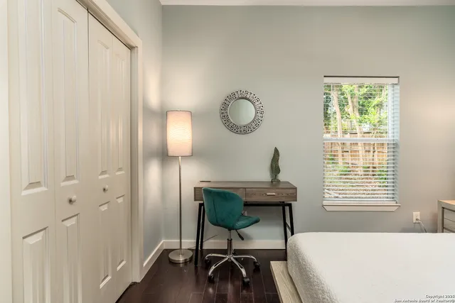 a view of a room with a table and chairs