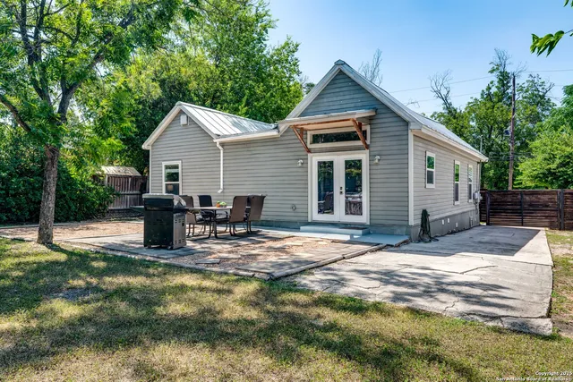 a view of a backyard with a patio