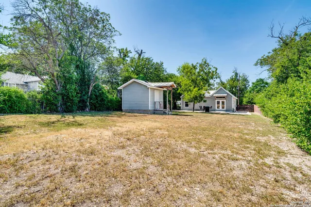 a house with trees in front of it