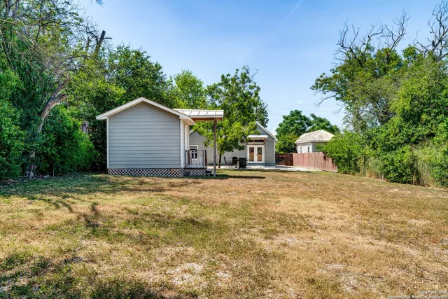 a view of large house with a yard and garage