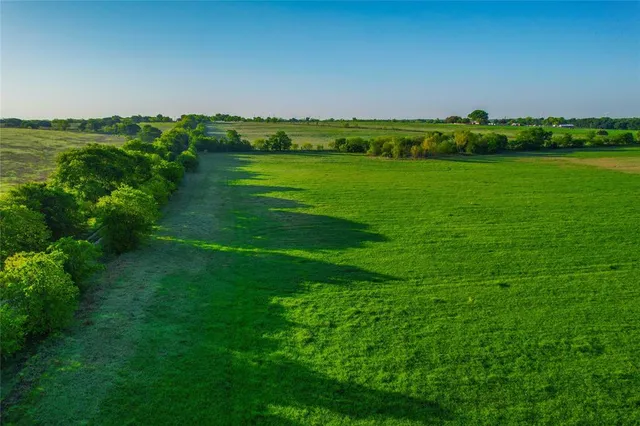a view of an ocean and a yard