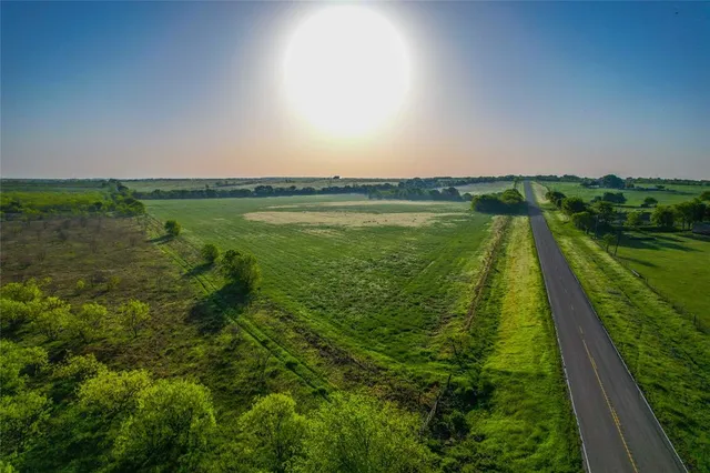 a view of a lake with a yard