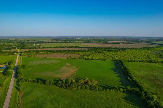 a view of a lake with a big yard