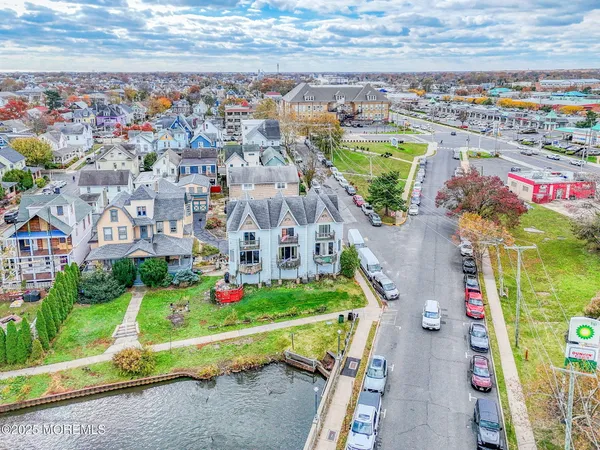 a view of a city with tall buildings and a yard